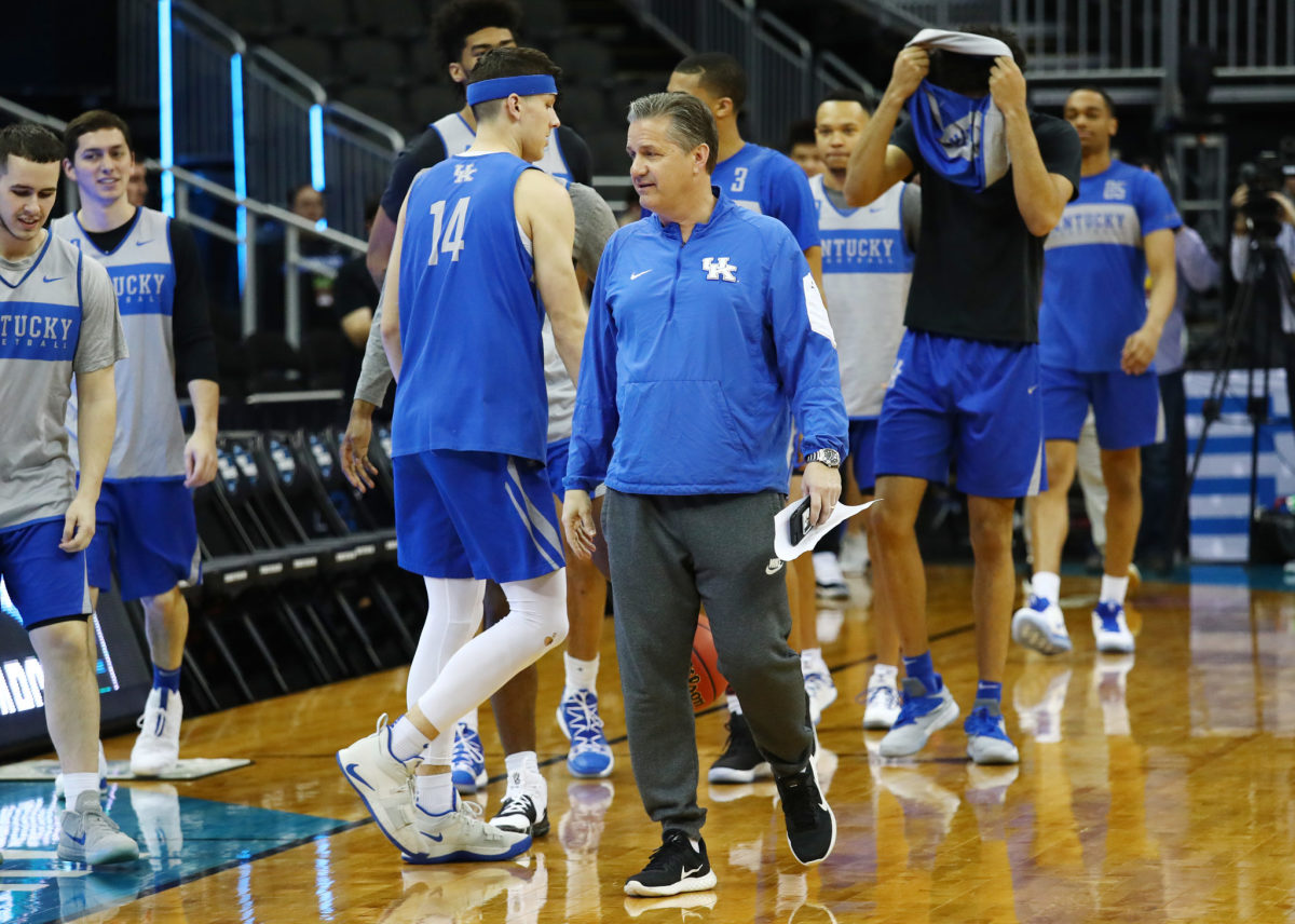 Coach Cal looks on during ncaa tournament practice.