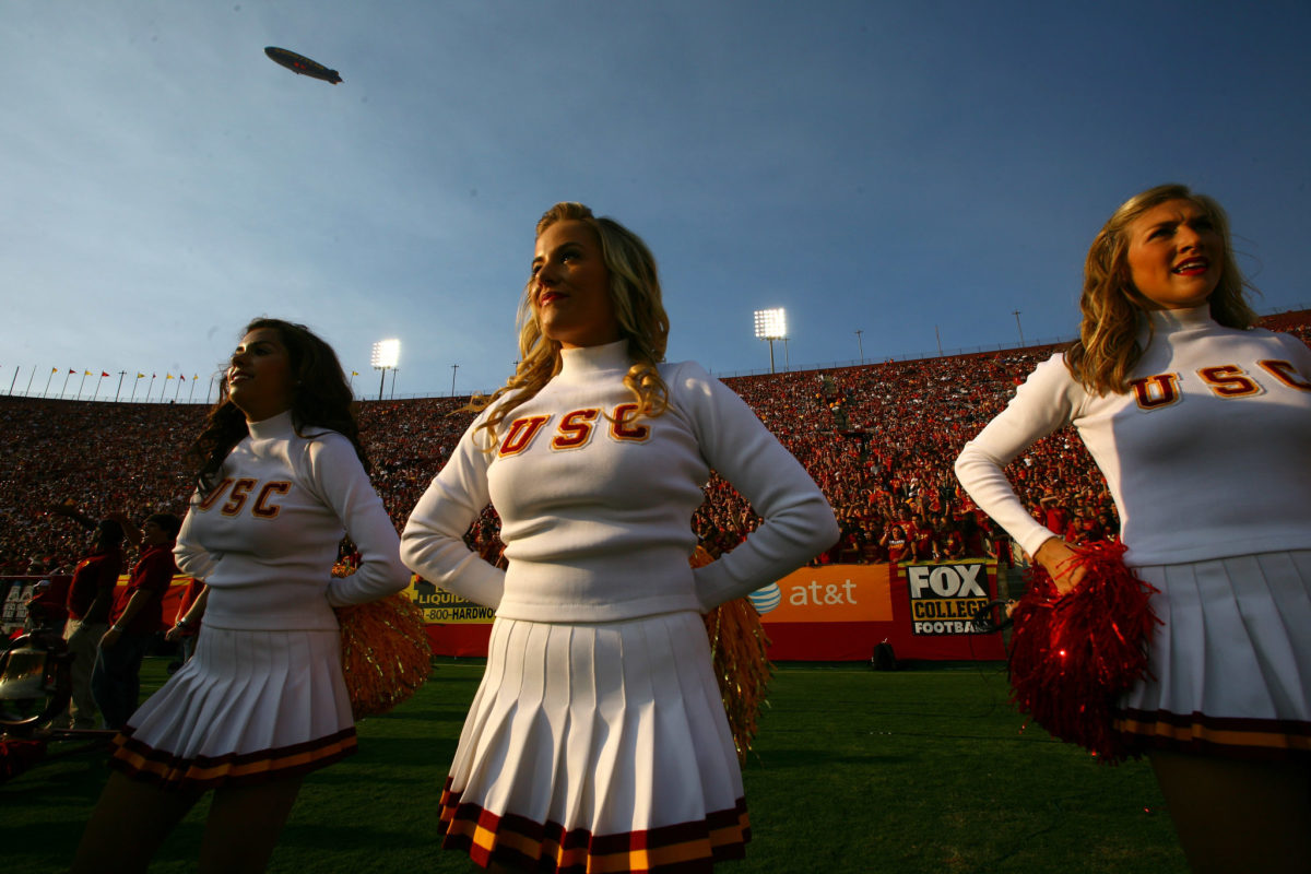 USC's cheerleaders with their pompoms at their sides.