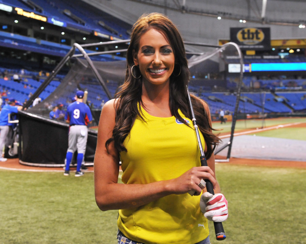 golfer holly sonders poses before throwing a first pitch