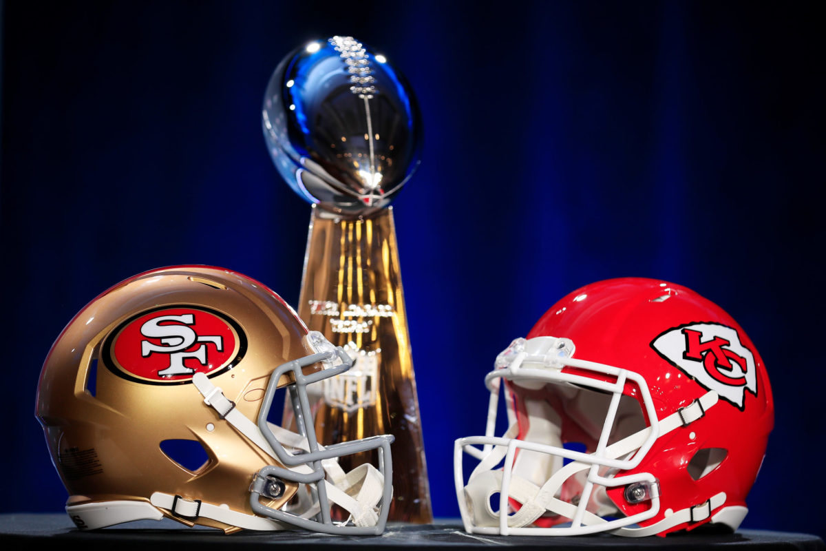 49ers and Chiefs helmets in front of the Lombardi Trophy ahead of the NFL Super Bowl in 2020.