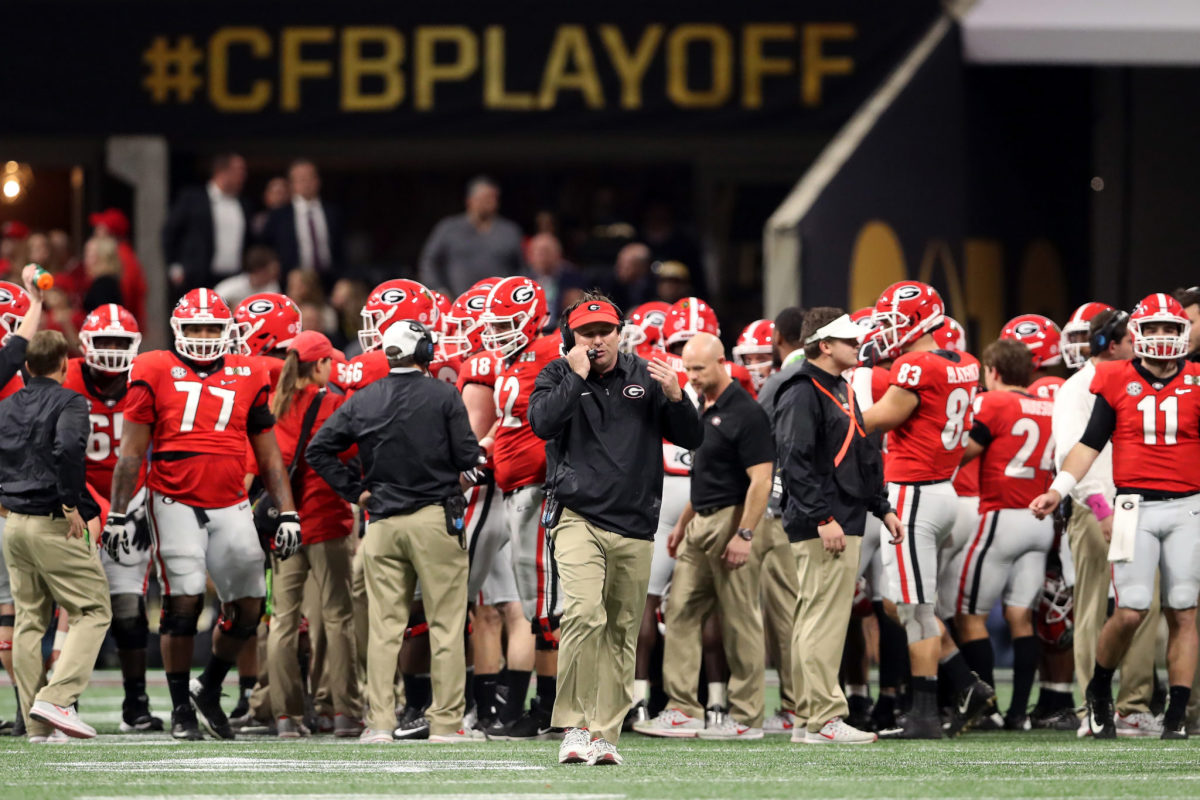 Kirby Smart speaking into a headset at the National Championship.