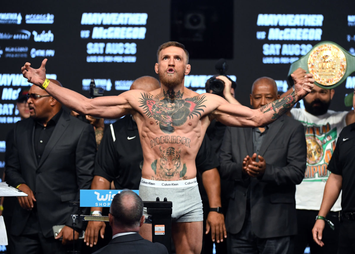 Conor McGregor flexing during his weigh in.