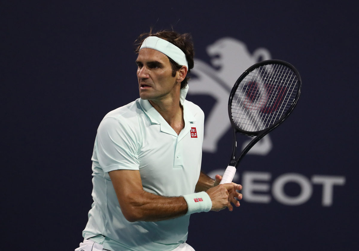 Roger Federer playing tennis.