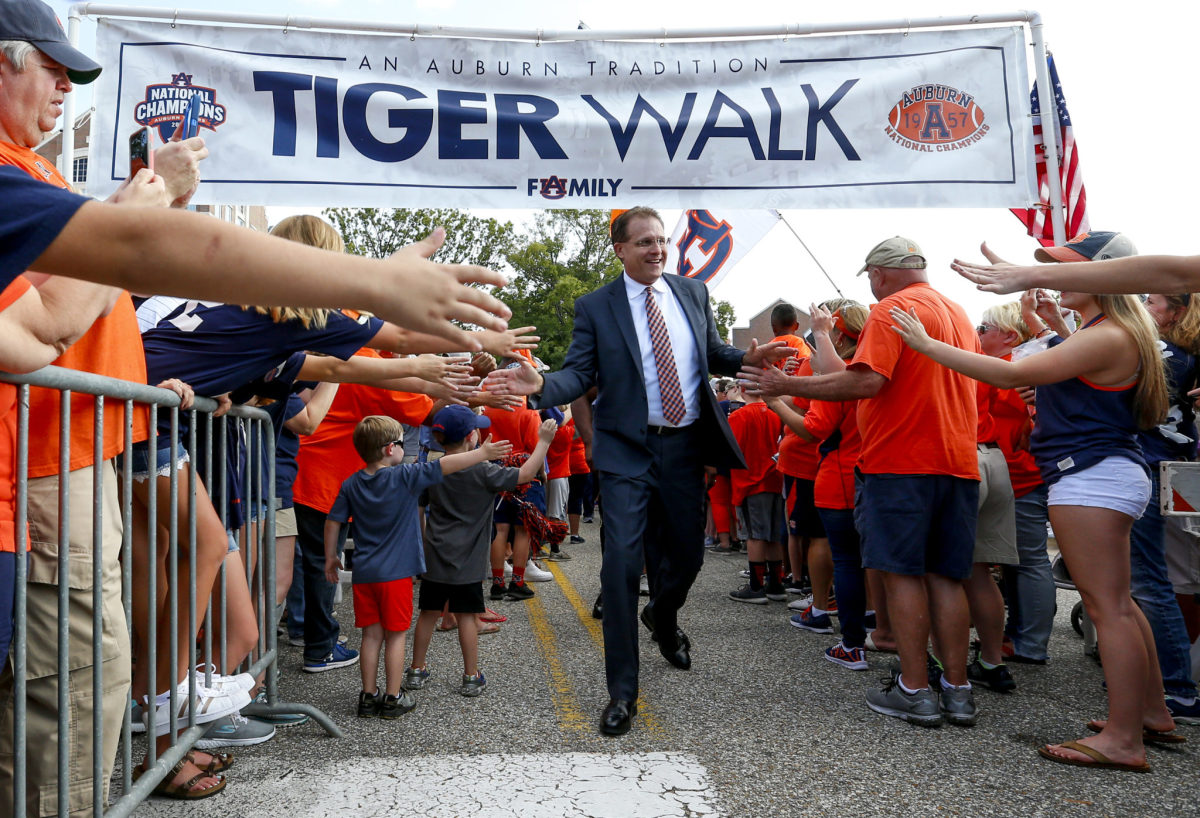 Gus Malzahn does the Tiger Walk with Auburn fans.