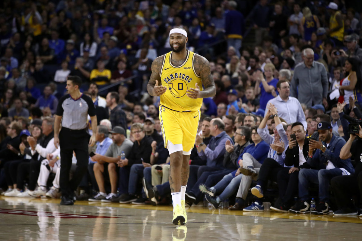 DeMarcus Cousins running up the floor during a Golden State Warriors game.