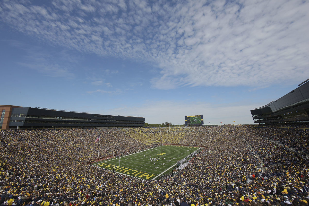 Fans attend the game between Eastern Michigan University Eagles and the University of Michigan Wolverines at Michigan Stadium.