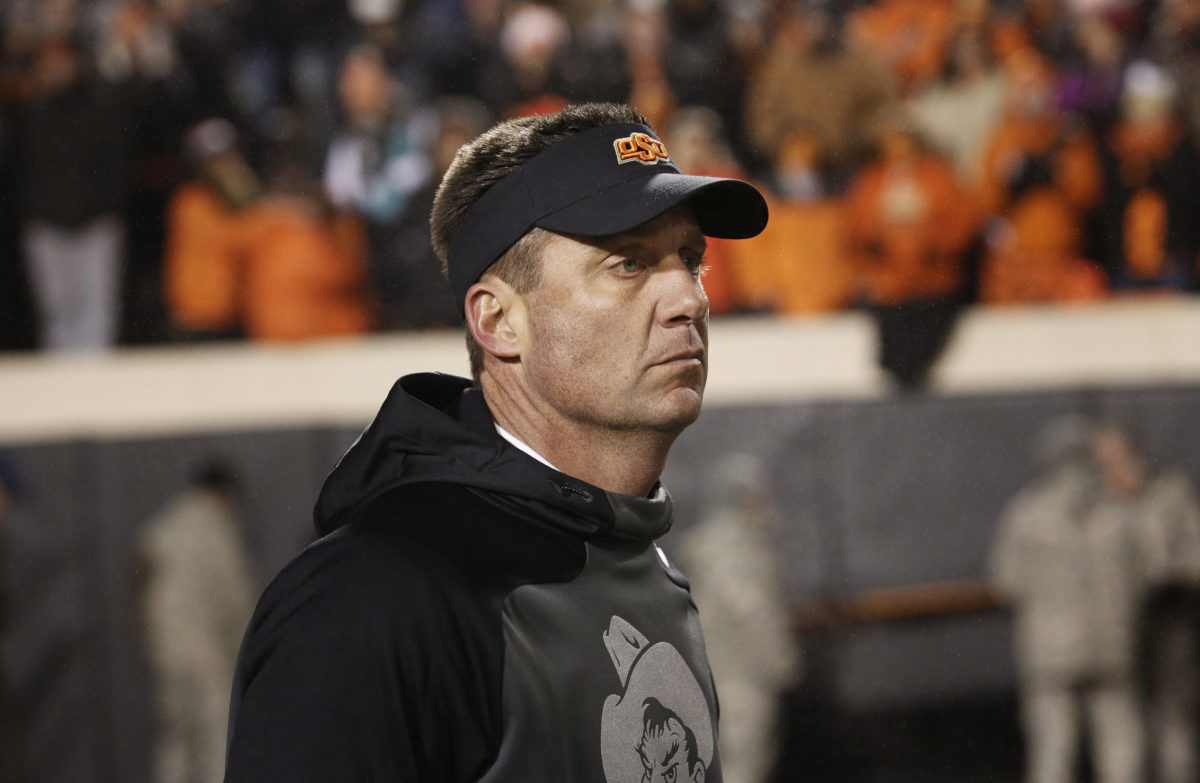 Oklahoma State head coach Mike Gundy prepares to coach his team in the Bedlam Game.