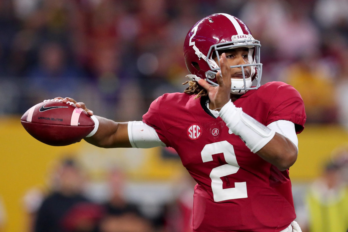 Jalen Hurts of the Alabama Crimson Tide looks for an open receiver against the USC Trojans.