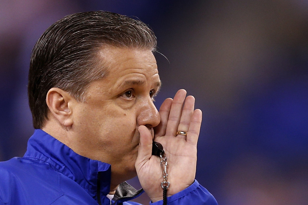 Coach Cal blowing a whistle