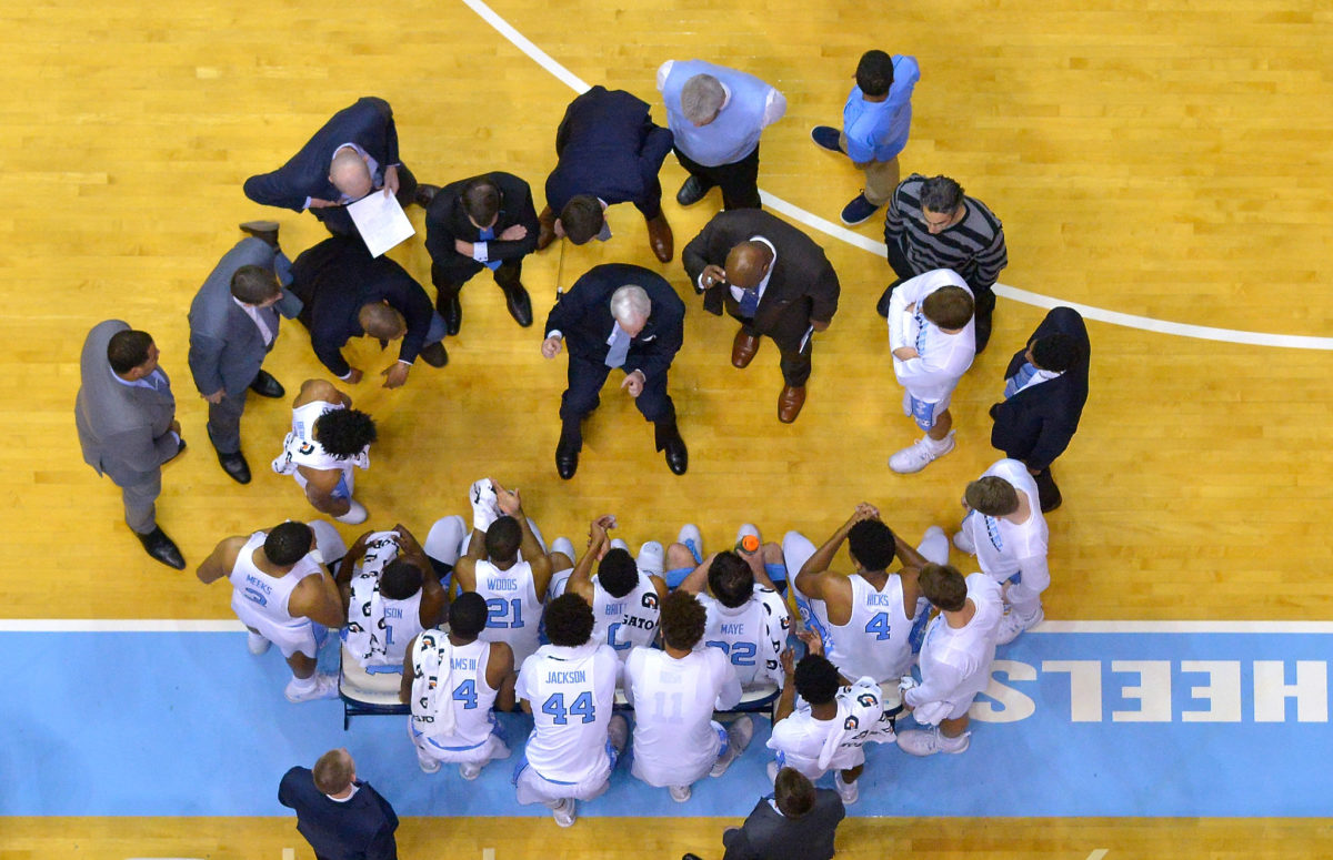 Roy Williams speaks to his players during a game.