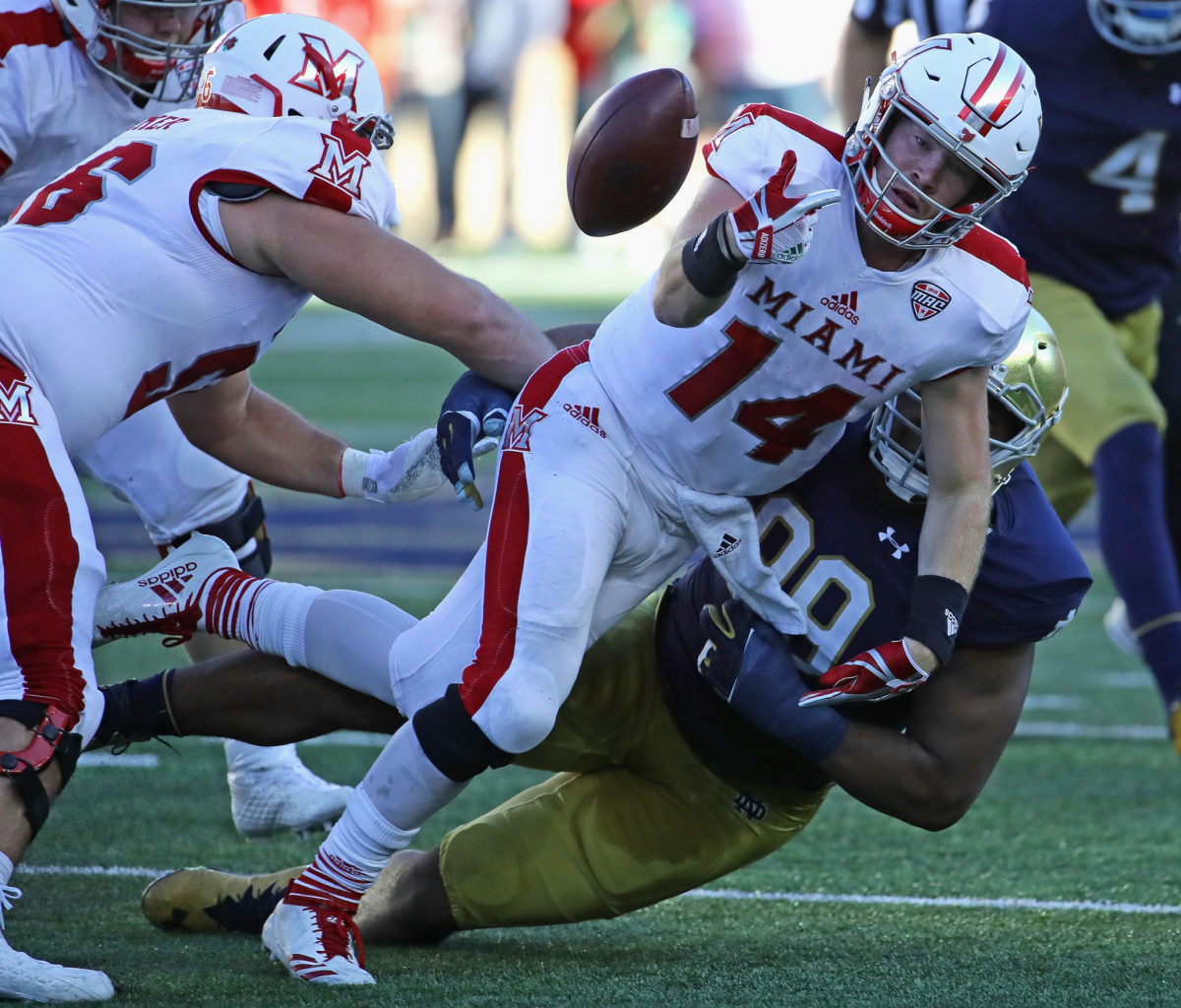 Miami (OH) quarterback Gus Ragland is taken down by Notre Dame's Jerry Tillery.