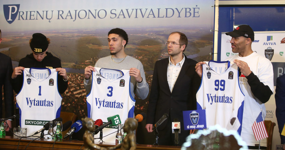 LaVar, LiAngelo and LaMelo Ball holding up with Vytautas uniforms.