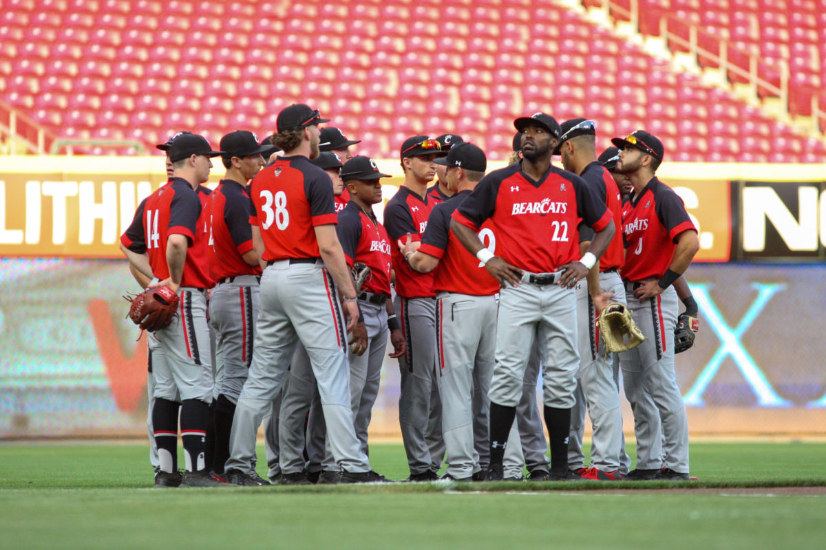 Cincinnati's baseball players huddle before a game.