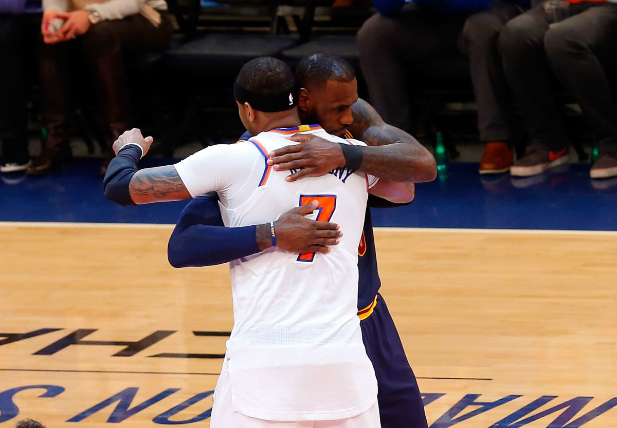 Carmelo Anthony and LeBron James embrace during a game.