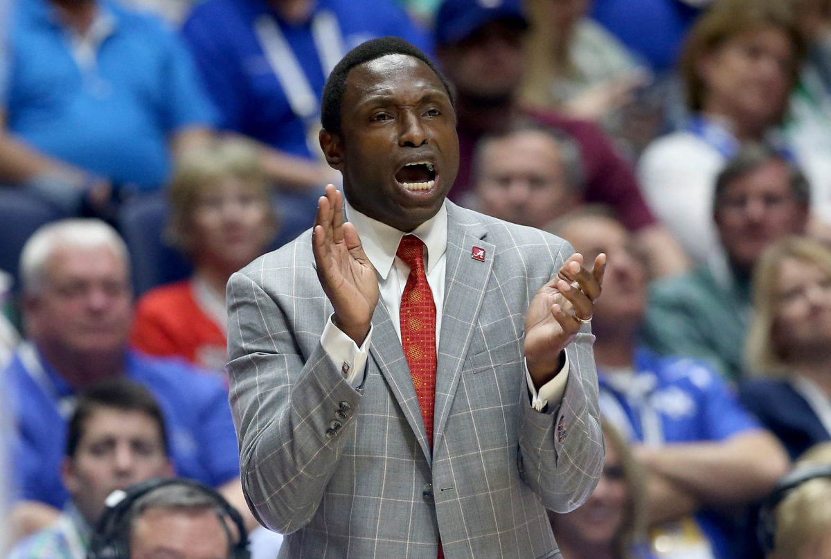 Avery Johnson the head coach of the Alabama Crimson Tide gives instructions to his team.