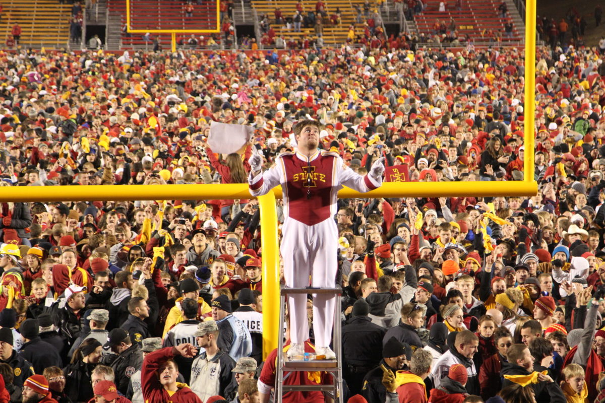 Iowa State fans rush the field after win.
