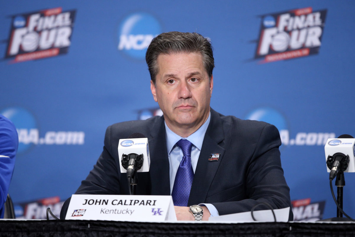 Head coach John Calipari of the Kentucky Wildcats looks on in the post game press conference after being defeated by the Wisconsin Badgers.