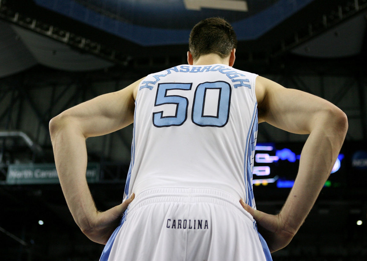 Tyler Hansbrough stands on the court.
