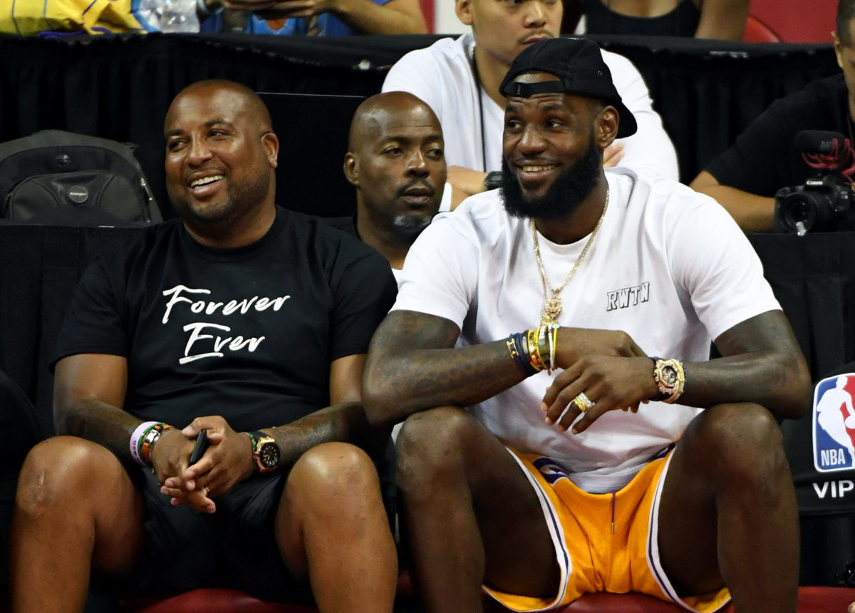 LeBron James sitting courtside at a game.