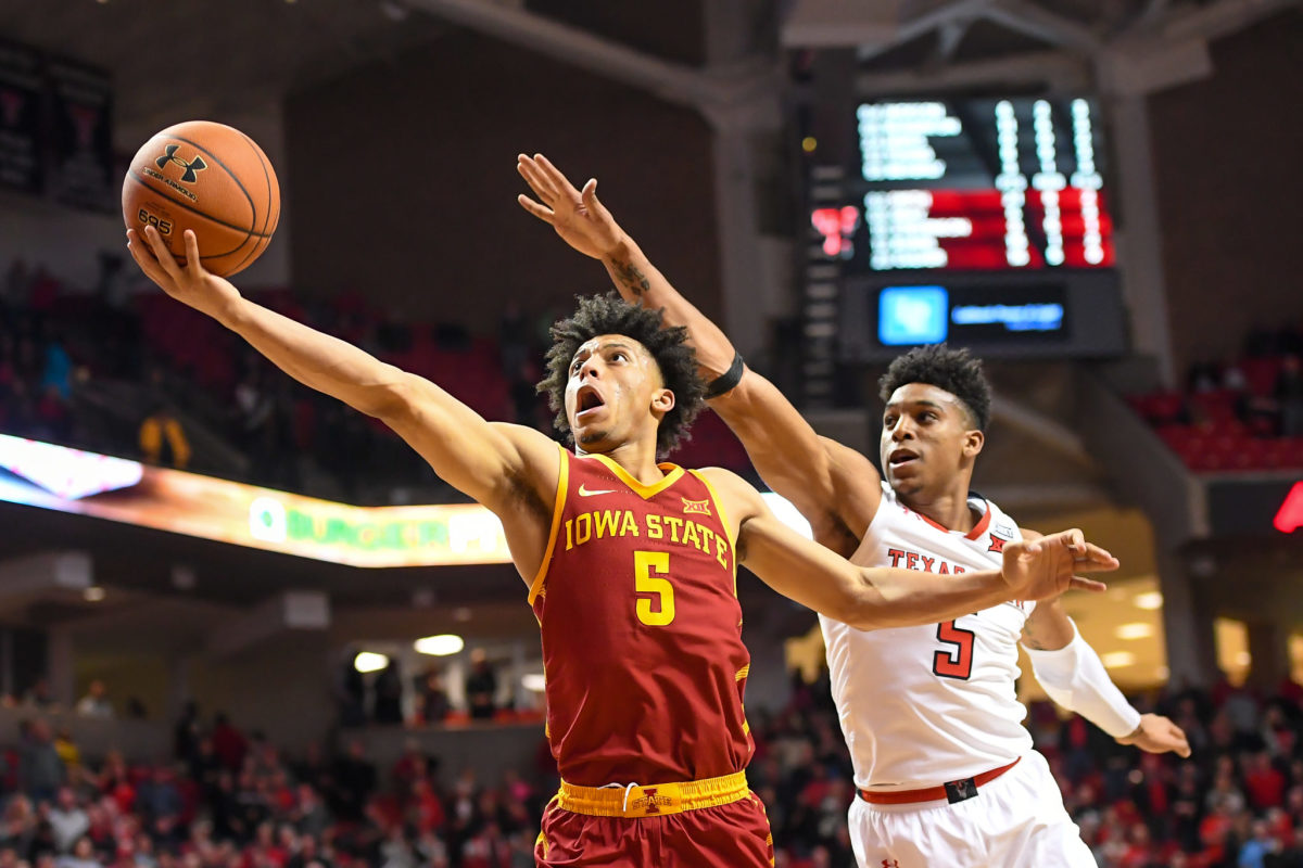 Lindell Wigginton #5 of the Iowa State Cyclones goes to the basket against Justin Gray #5 of the Texas Tech Red Raiders during the second half of the game.