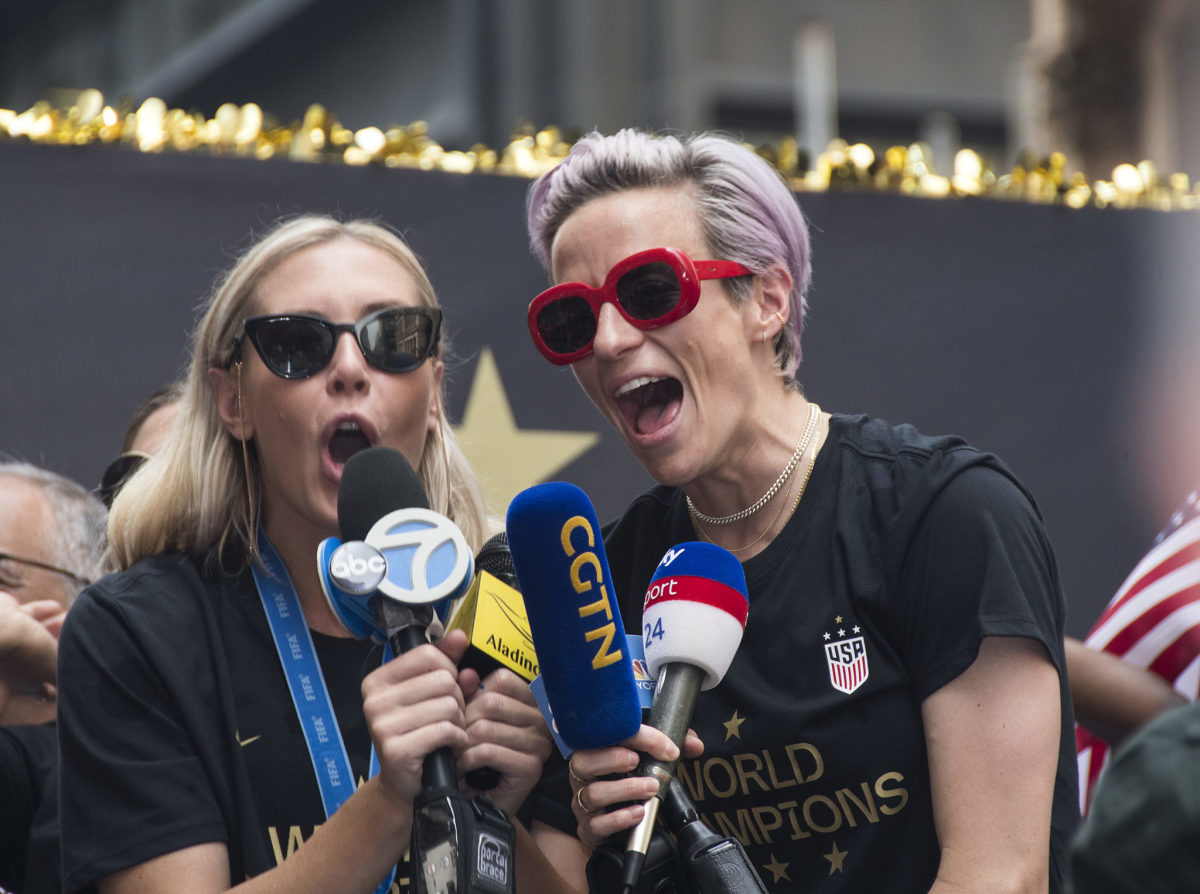 Allie Long and Megan Rapinoe celebrate the World Cup win.