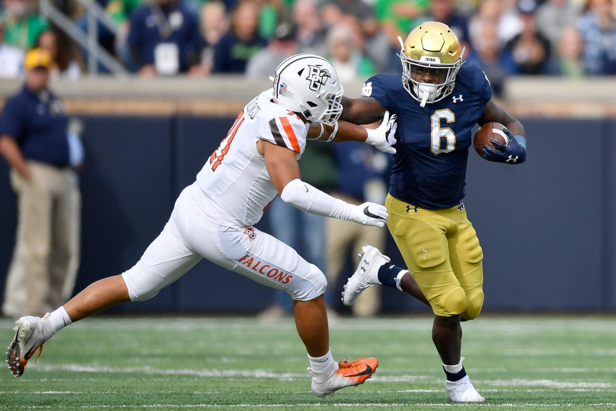 Tony Jones runs with the ball in a game for Notre Dame.