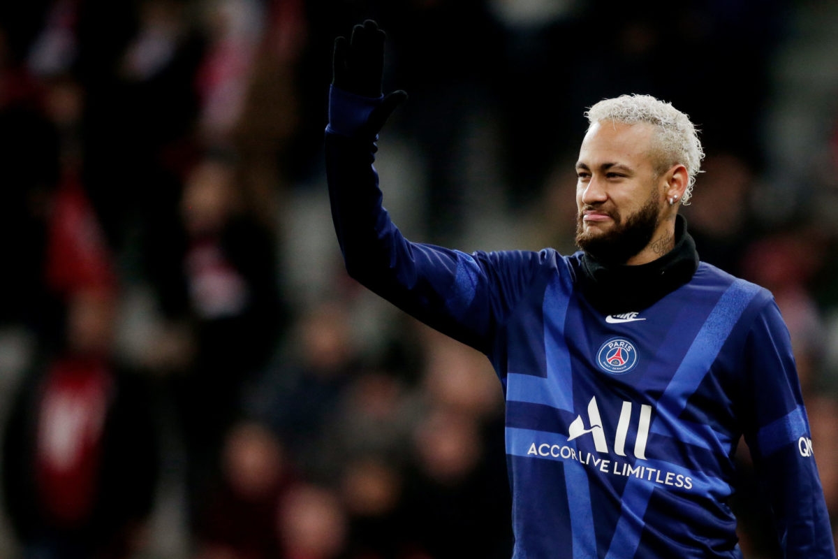 Neymar waves to the crowd during a PSG game.