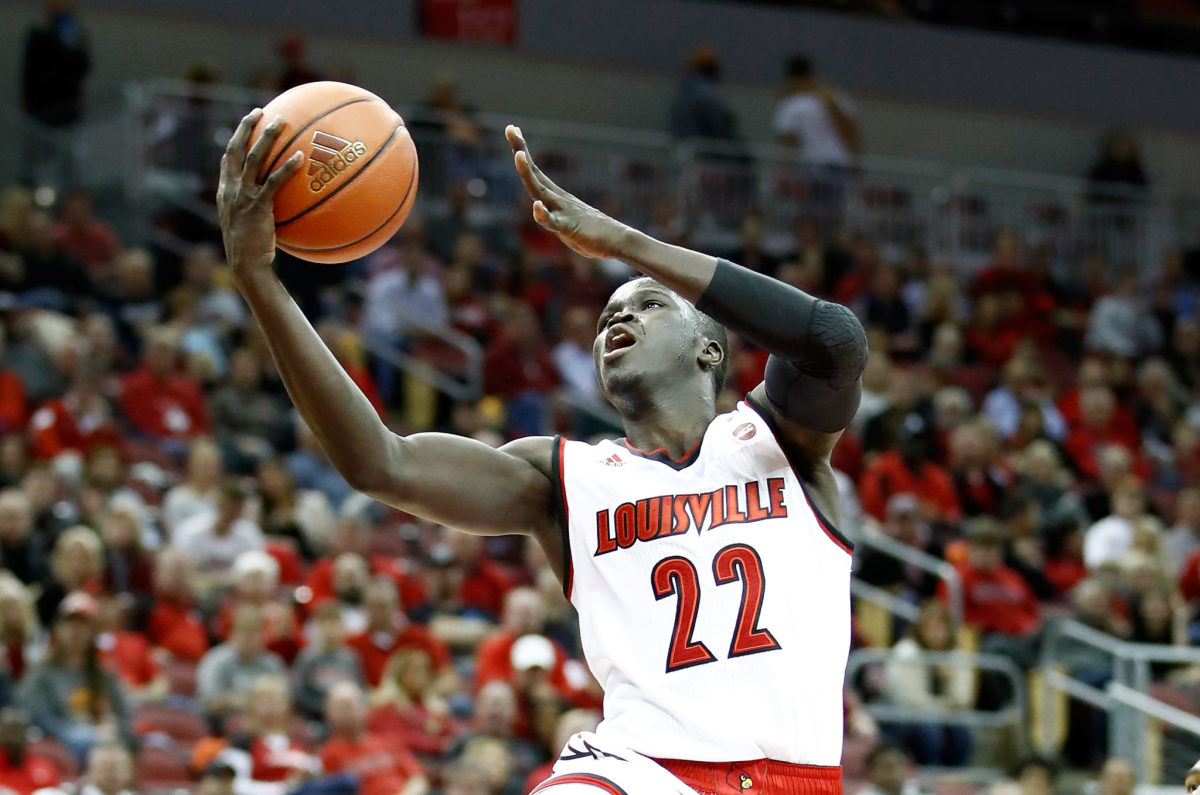 Deng Adel shoots a layup for Louisville.