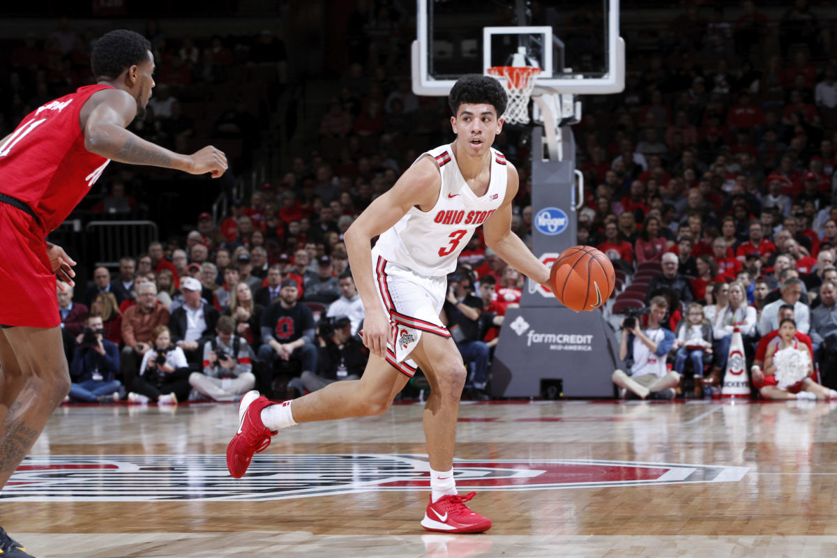 Ohio State point guard D.J. Carton dribbles during a game.