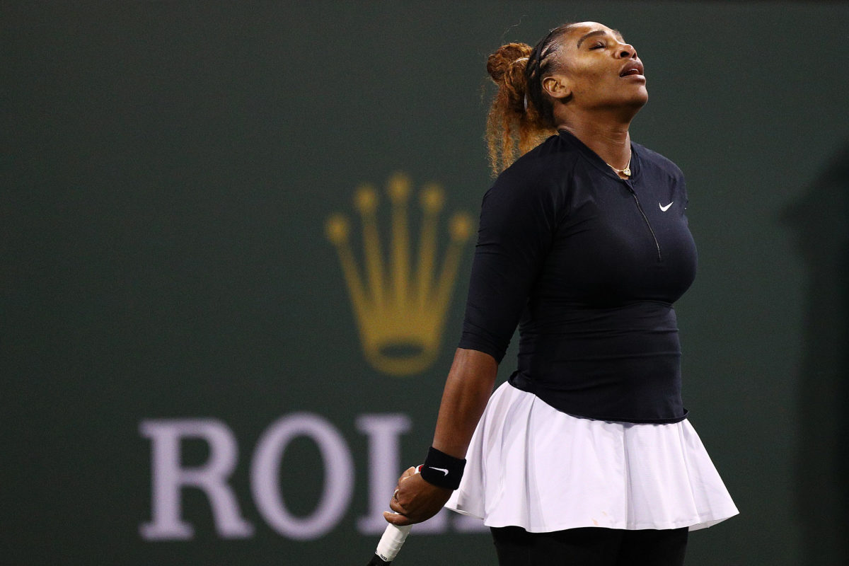 Serena Williams reacting during a tennis match.