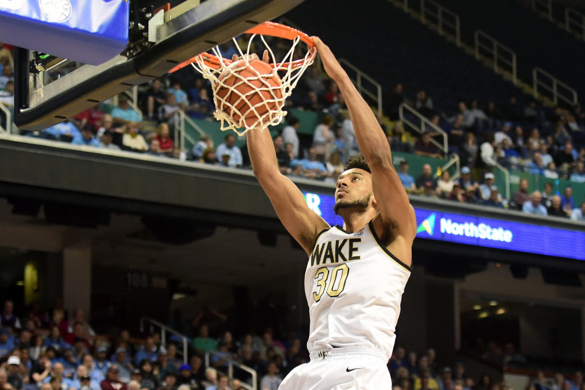 New Kentucky basketball big man Olivier Sarr dunks the ball for Wake Forest.