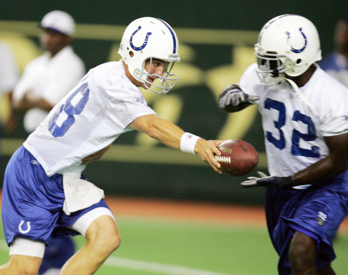 Peyton Manning hands off to Colts teammate Edgerrin James during practice.