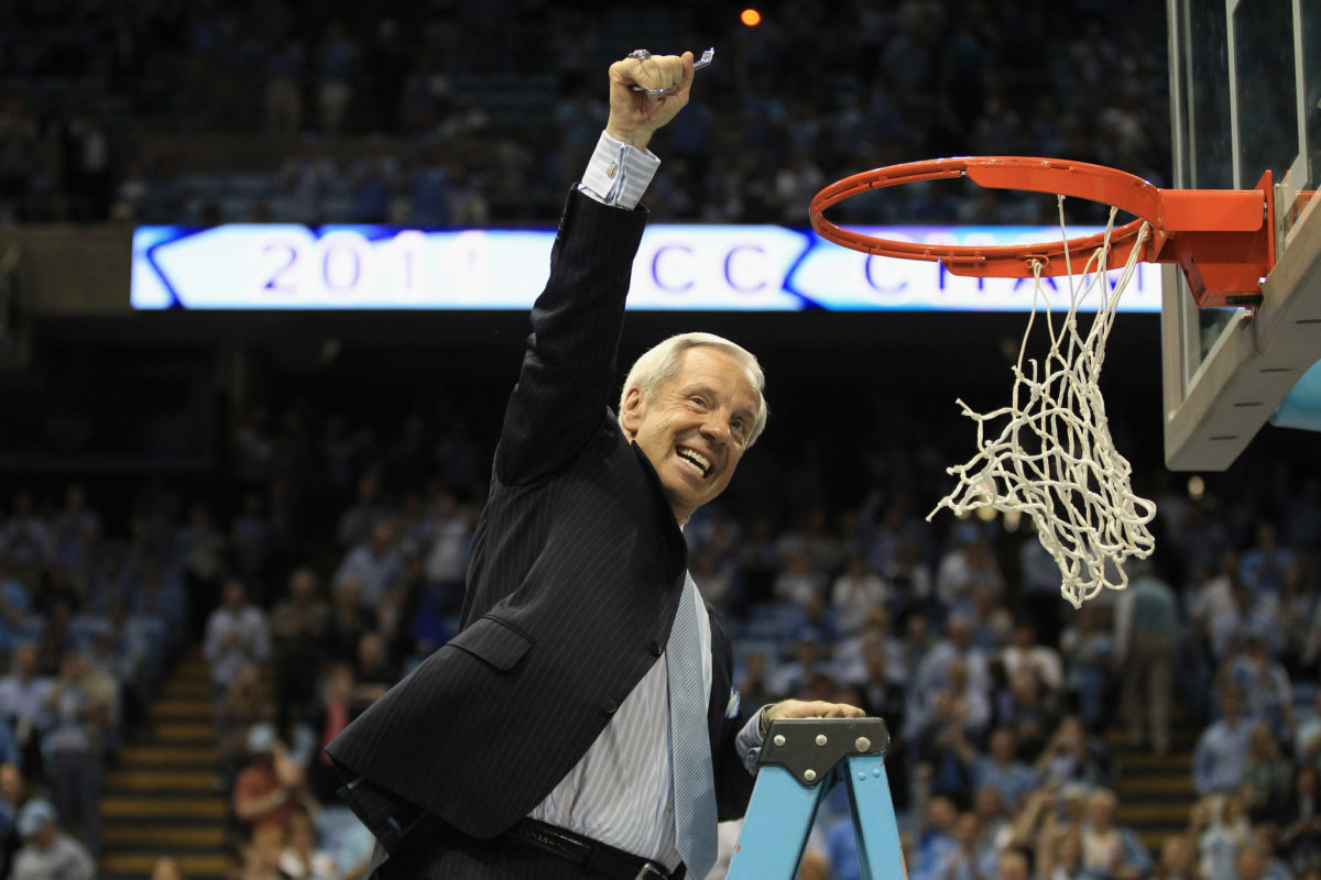 Roy Williams cutting down the net.
