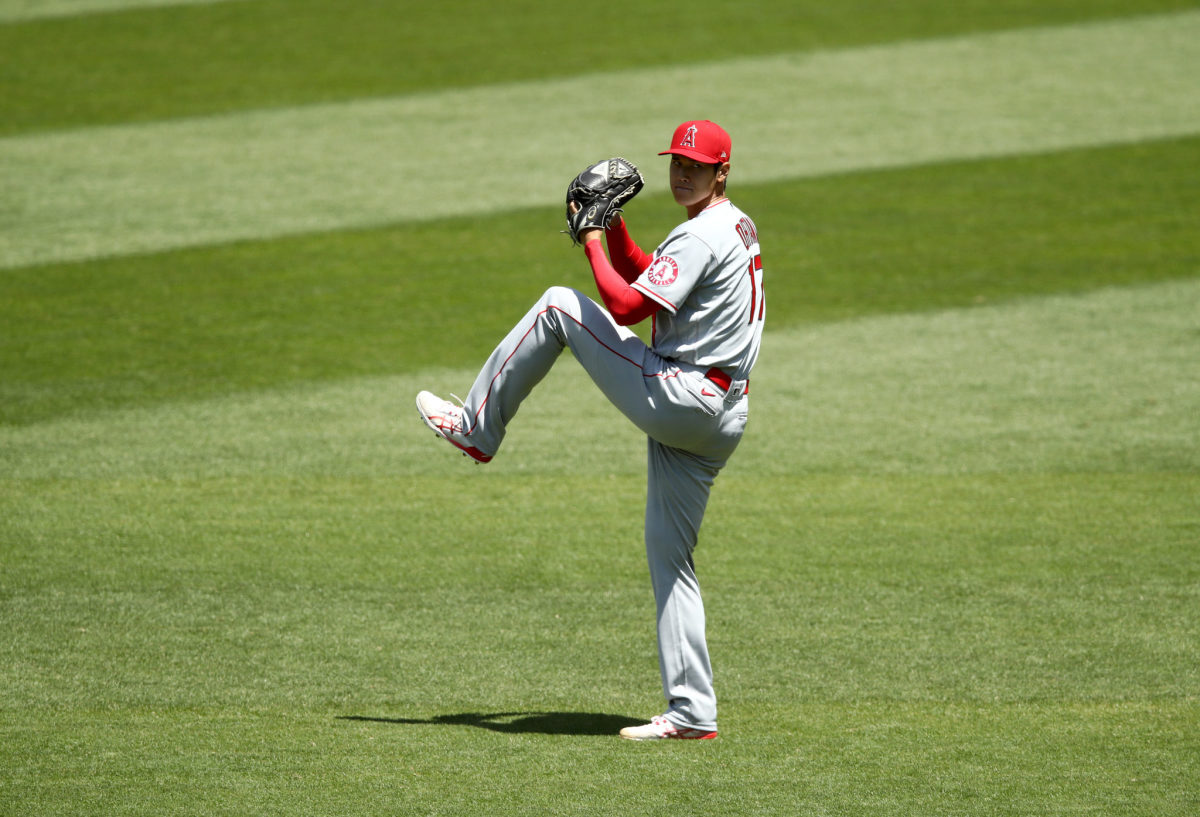 Shohei Ohtani warms up in the outfield before a game for the Angels.