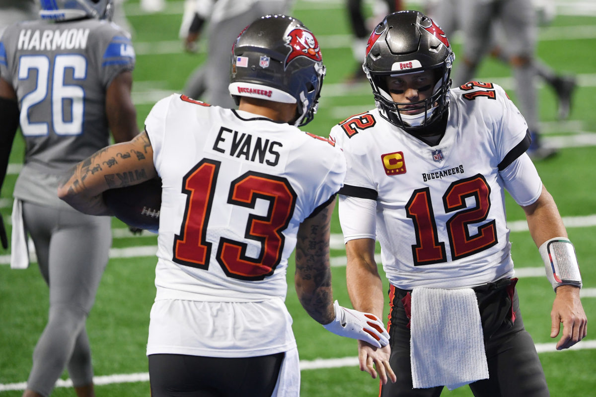 Tampa Bay Buccaneers wide receiver Mike Evans and quarterback Tom Brady shake hands.