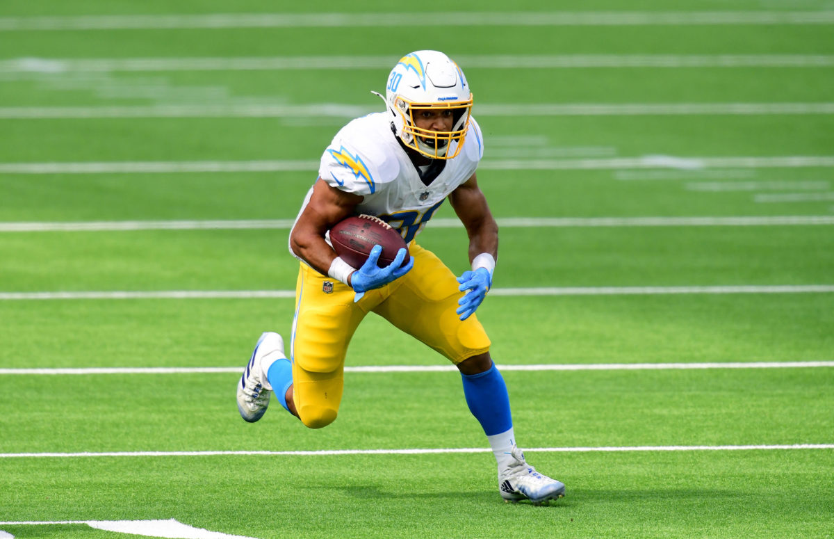 Austin Ekeler runs the football for the Chargers.