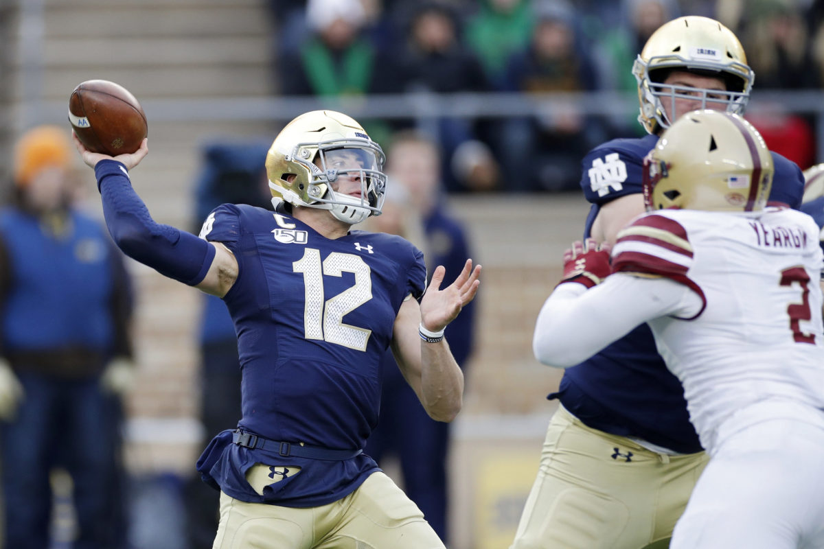 Notre Dame QB Ian Book throwing vs. Boston College during a 2019 college football game.