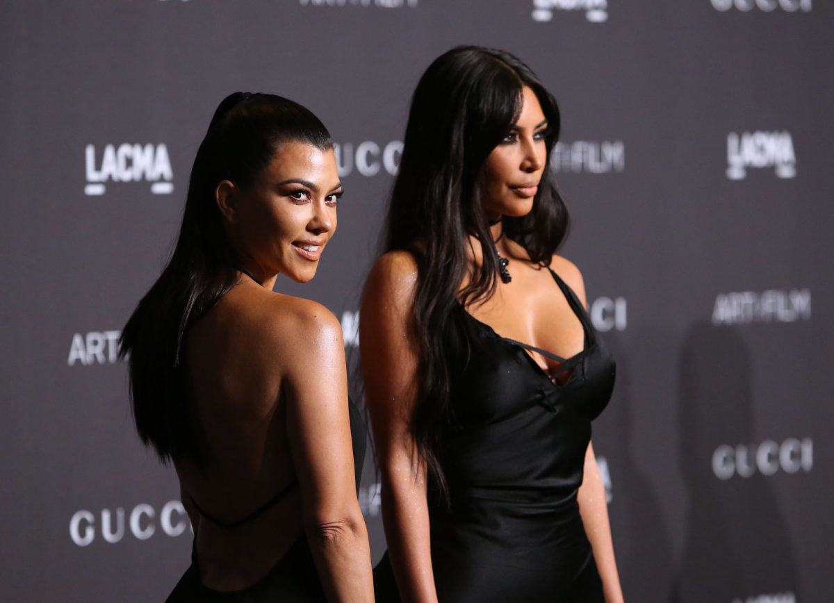 Kourtney and Kim Kardashian on the red carpet.