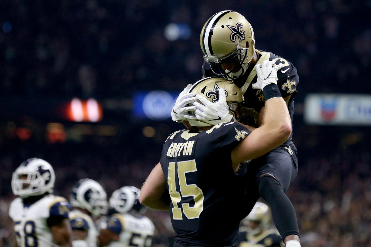 NEW ORLEANS, LOUISIANA - JANUARY 20: Garrett Griffin #45 of the New Orleans Saints celebrates with Michael Thomas #13 after scoring a touchdown thrown by Drew Brees #9 against the Los Angeles Rams during the first quarter in the NFC Championship game at the Mercedes-Benz Superdome on January 20, 2019 in New Orleans, Louisiana. (Photo by Jonathan Bachman/Getty Images)
