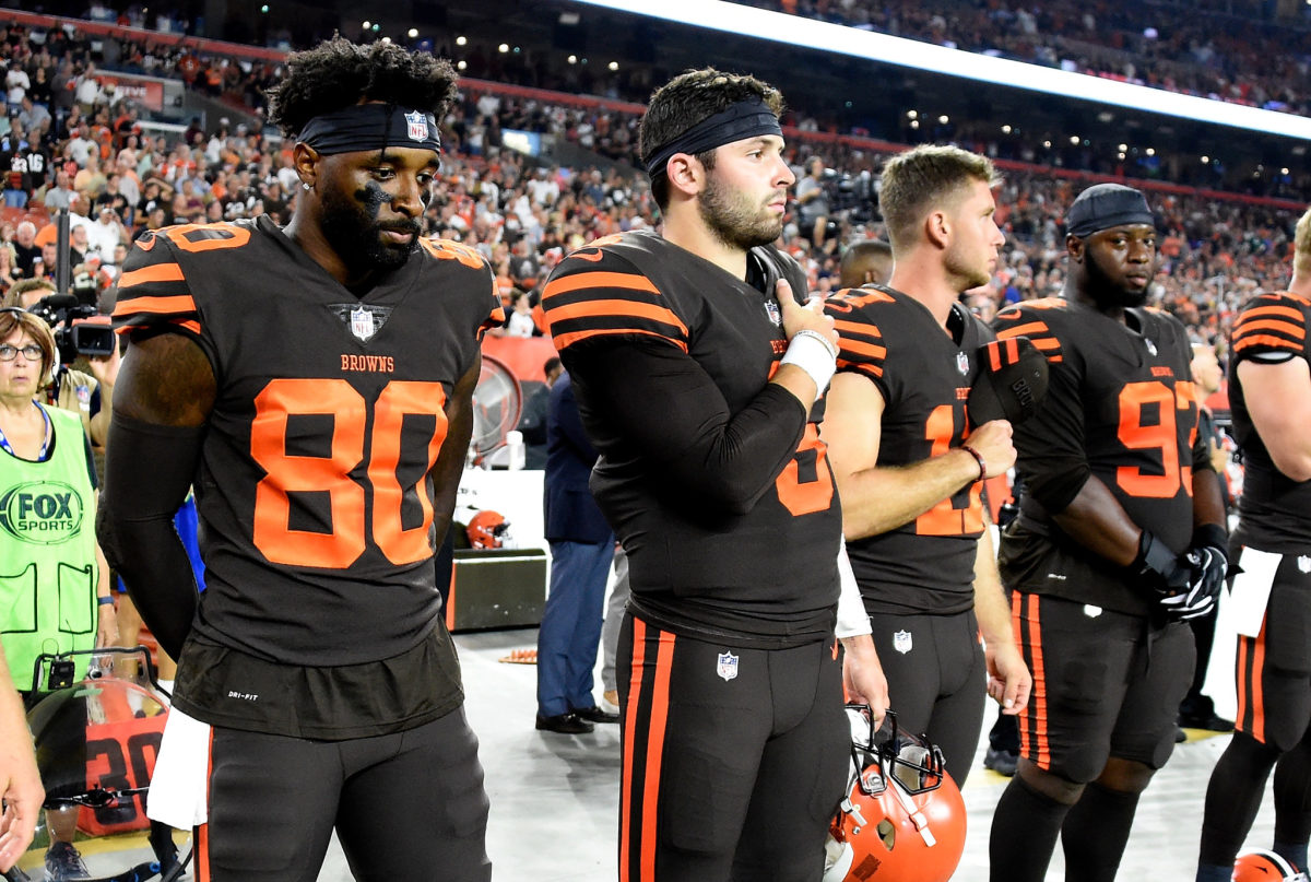 Cleveland Browns Baker Mayfield holds his hand over his heart during national anthem.