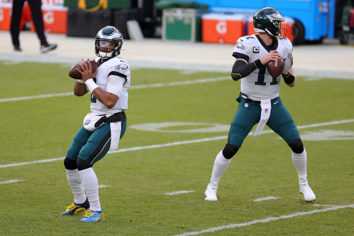 Eagles quarterbacks Jalen Hurts and Carson Wentz on Sunday against Green Bay.