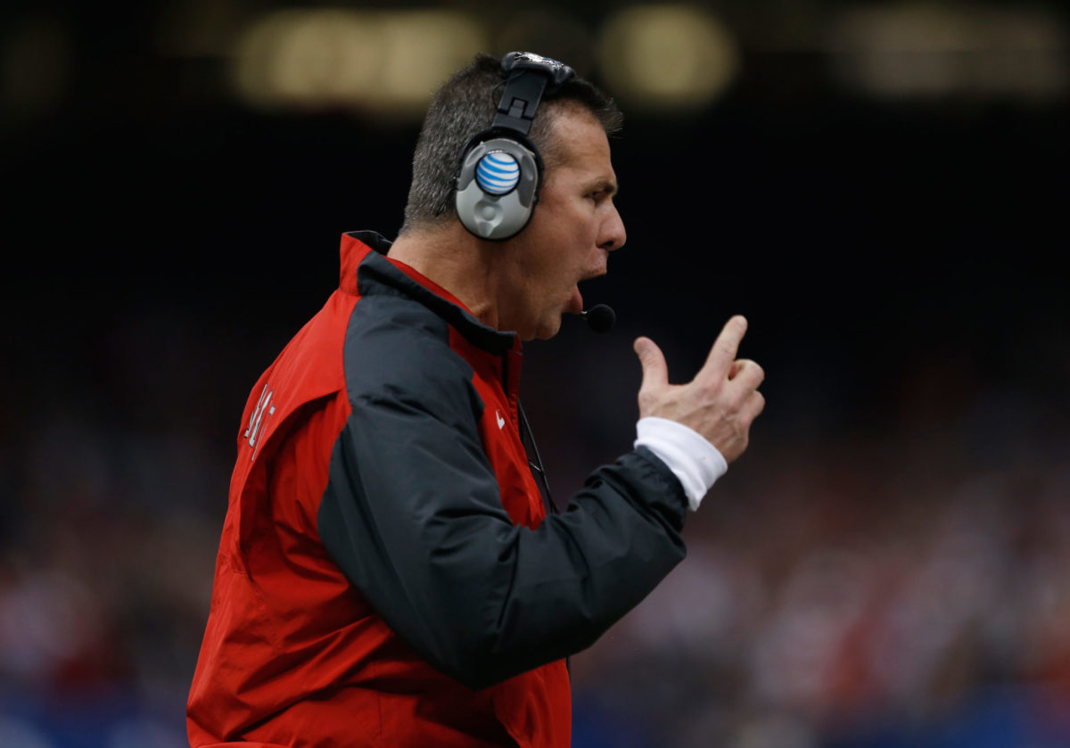 A closeup of Urban Meyer yelling during an Ohio State game.