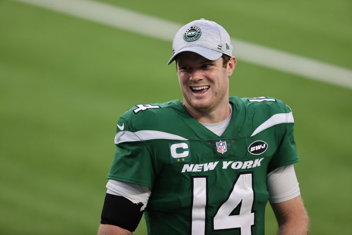 New York Jets quarterback Sam Darnold smiles after the win.