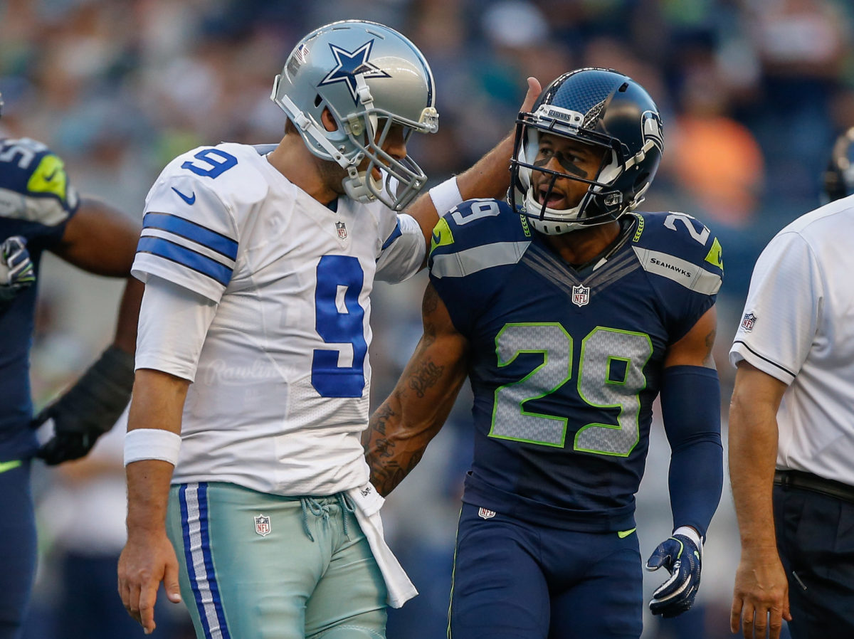 Earl Thomas and Tony Romo talk during a Dallas Cowboys vs. Seattle Seahawks game in 2016.