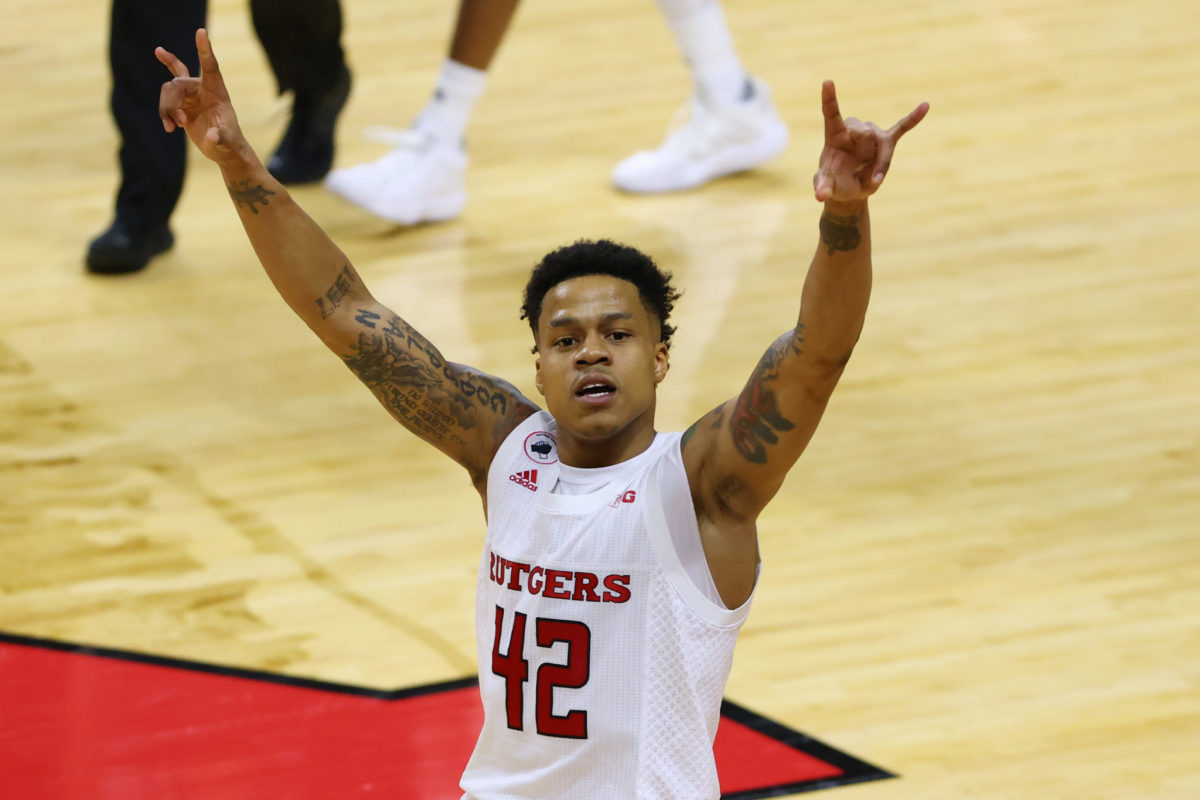Jacob Young on the court celebrating a win for Rutgers basketball.