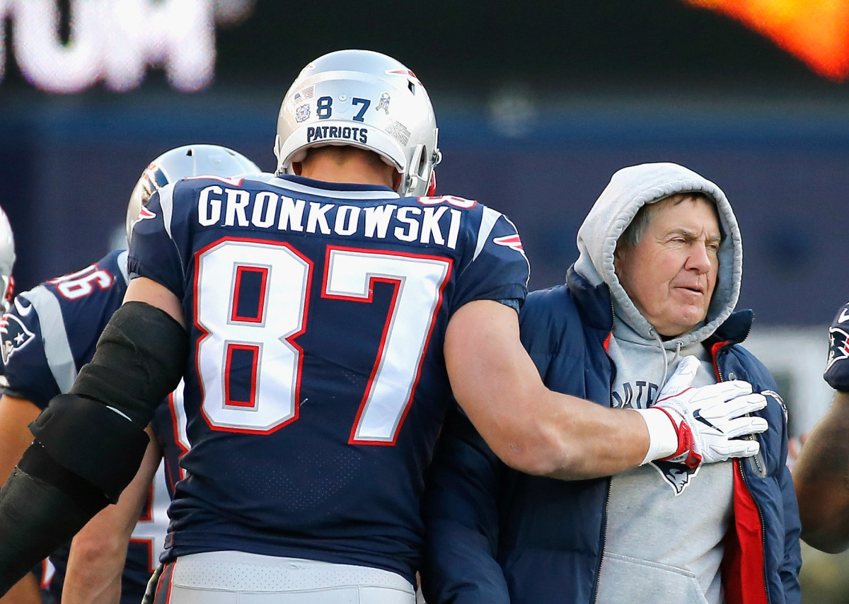 Patriots tight end Rob Gronkowski and New England head coach Bill Belichick on the field.
