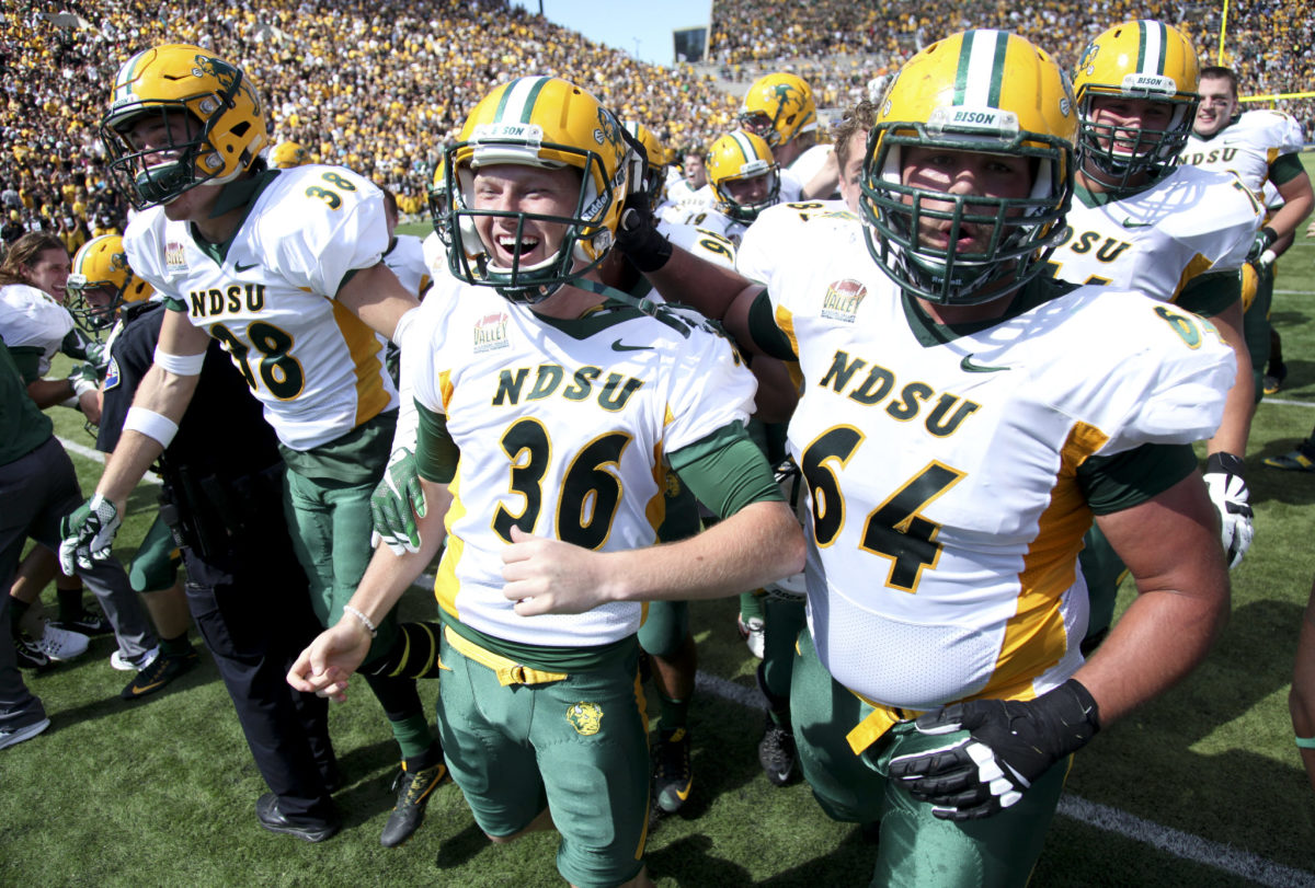 North Dakota State football players celebrate after a game.