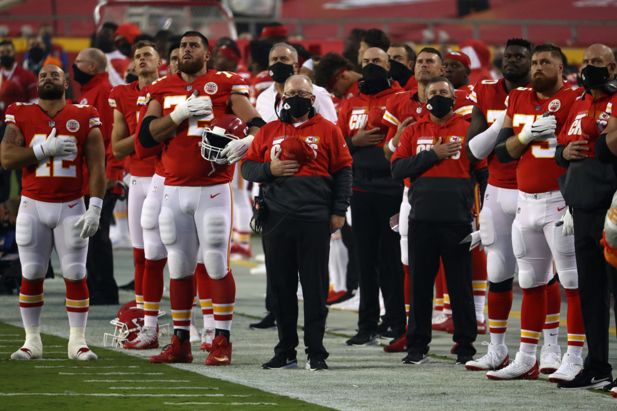 Kansas City Chiefs stand for the national anthem.
