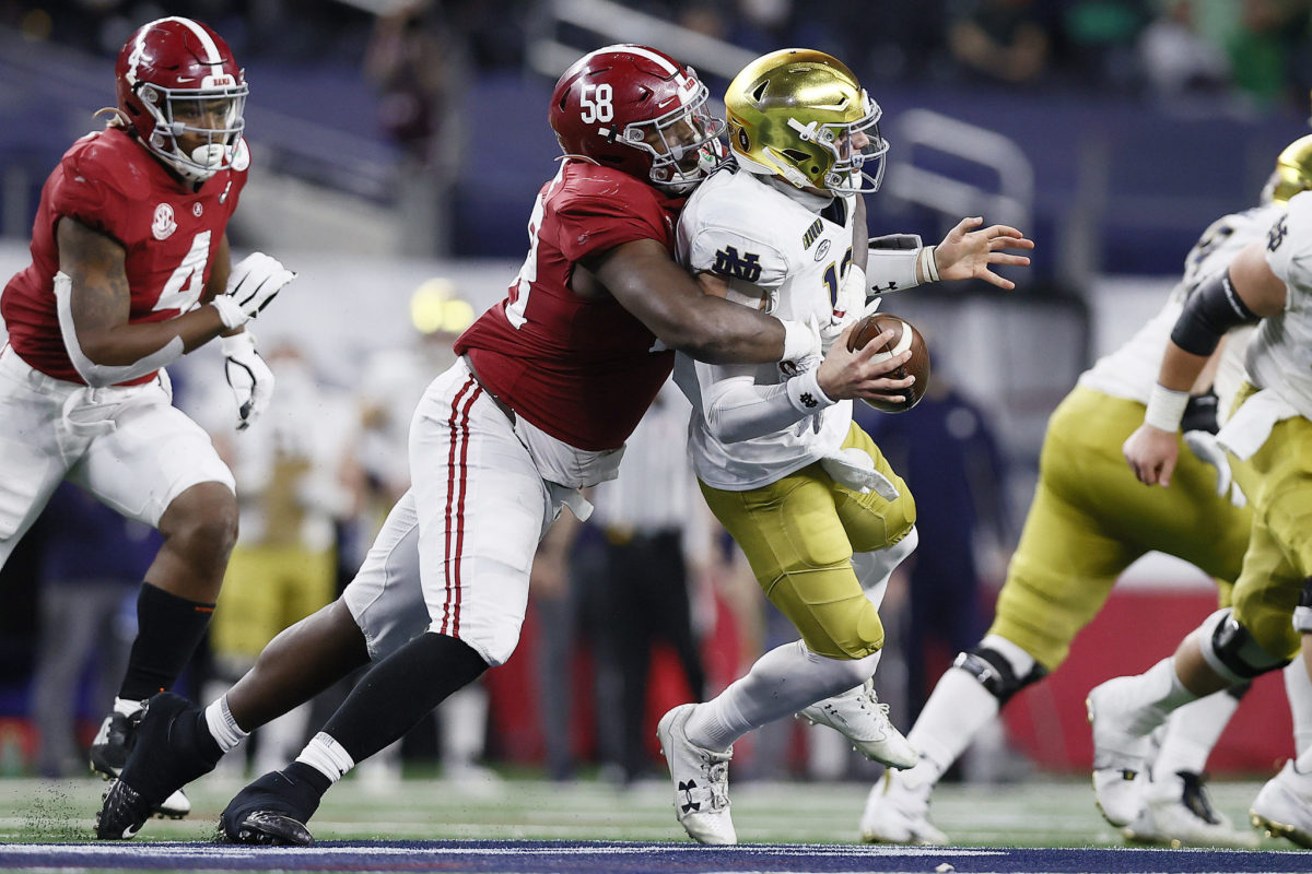 Ian Book sacked in the College Football Playoff by Alabama star Christian Barmore.