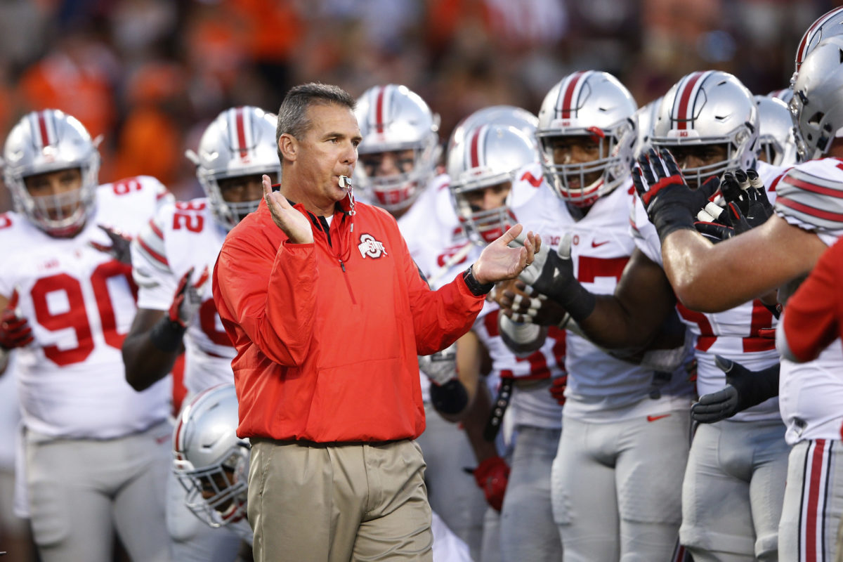 Urban Meyer hyping up the Ohio State football team before a game.